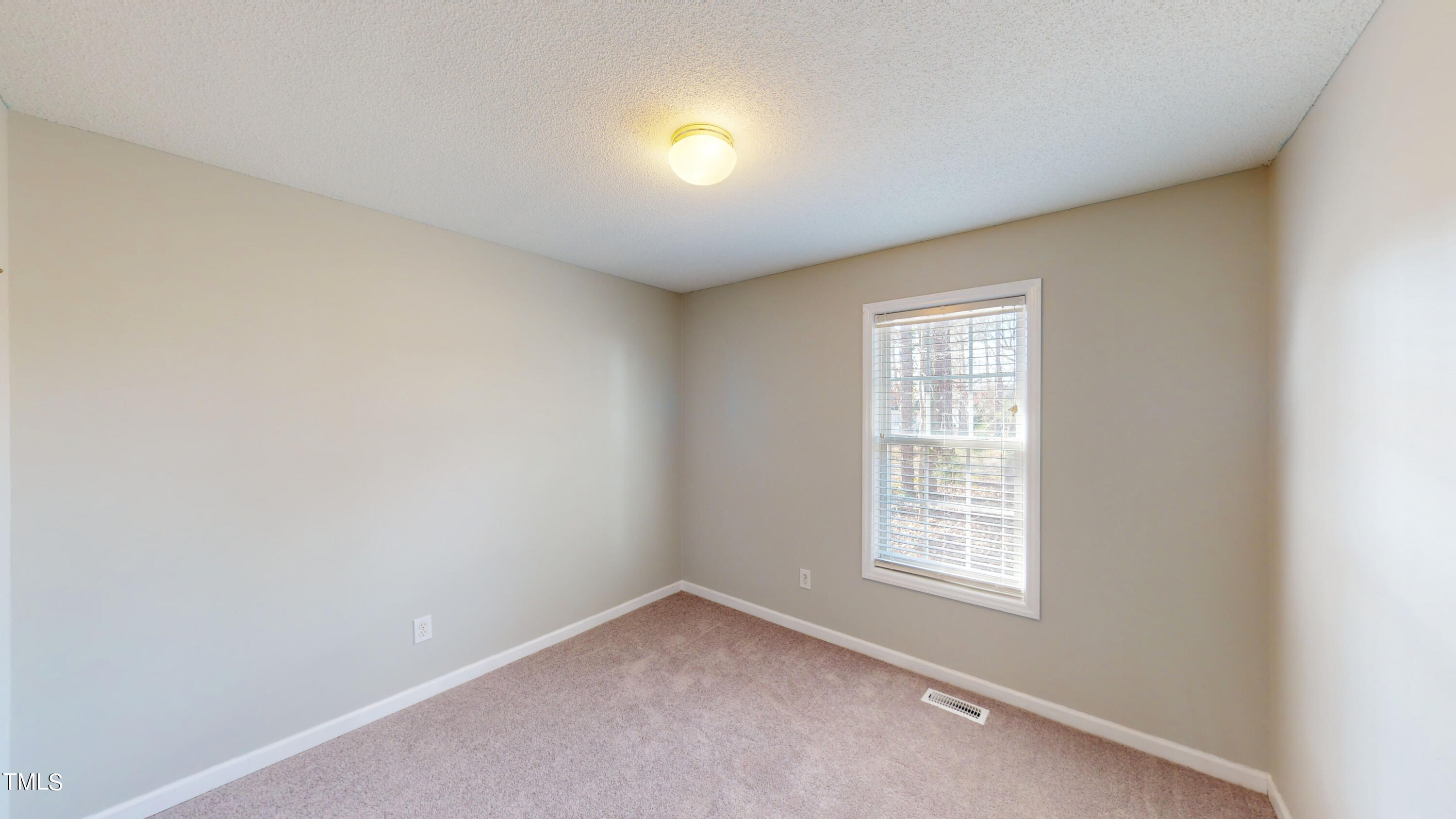 115 Stoneview Circle Smithfield, NC 27577 - Photo 29 of 35 an empty room with a window