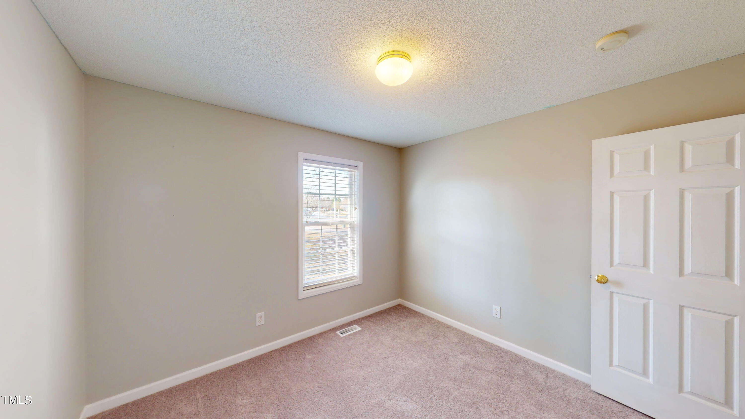 115 Stoneview Circle Smithfield, NC 27577 - Photo 33 of 35 an empty room with windows