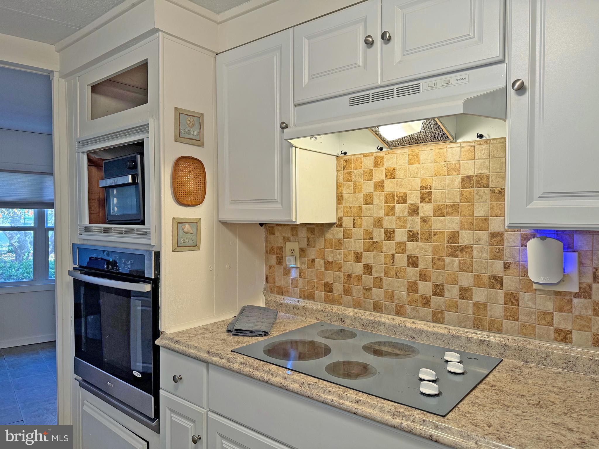 19666 Princess Street, Unit 131 Rehoboth Beach, DE 19971 - Photo 11 of 35 Cooktop & Wall Oven