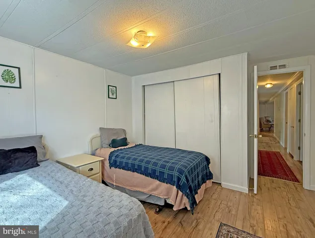 a bedroom with a bed and a view of bedroom