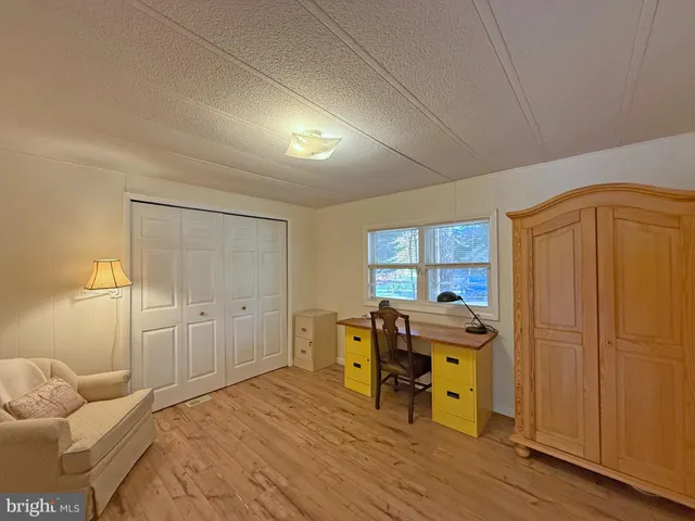 a bed room with a bed and furniture