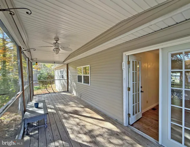 a view of a porch with wooden floor and outdoor space