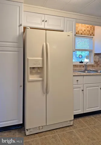 a bathroom with a shower and a sink