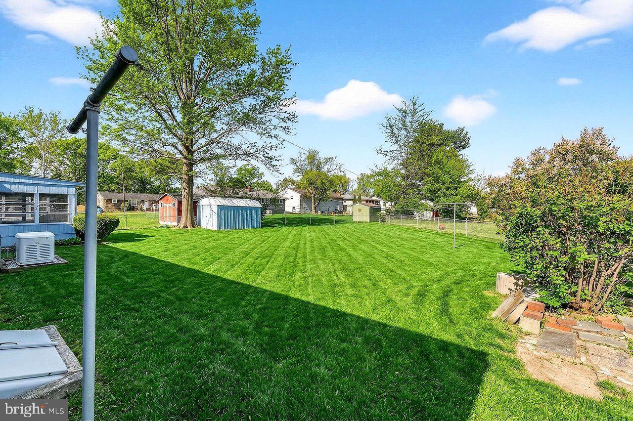 3 Delotto Drive Hamilton, NJ 08619 - Photo 15 of 18 a view of a house with a big yard and large trees
