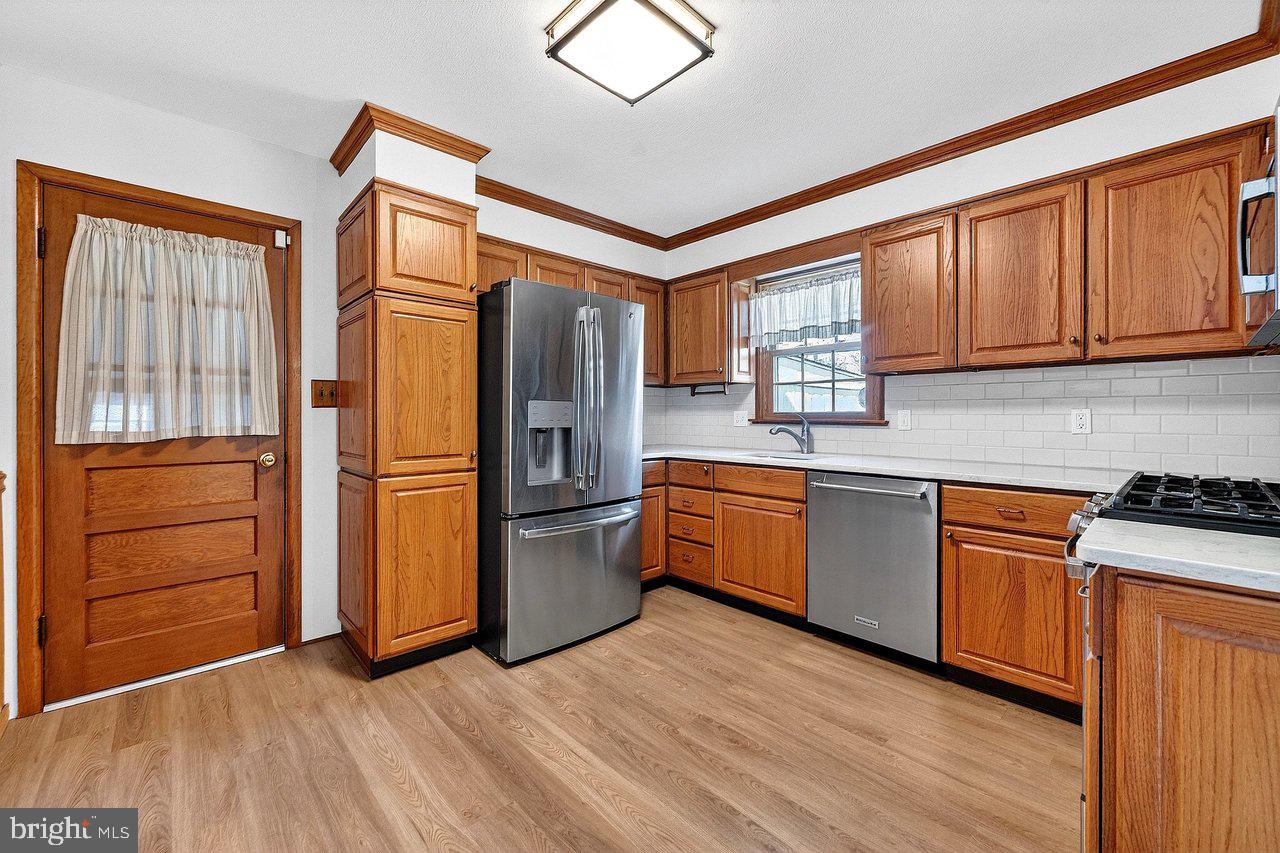 3 Delotto Drive Hamilton, NJ 08619 - Photo 5 of 18 a kitchen with stainless steel appliances granite countertop a refrigerator a sink and a stove