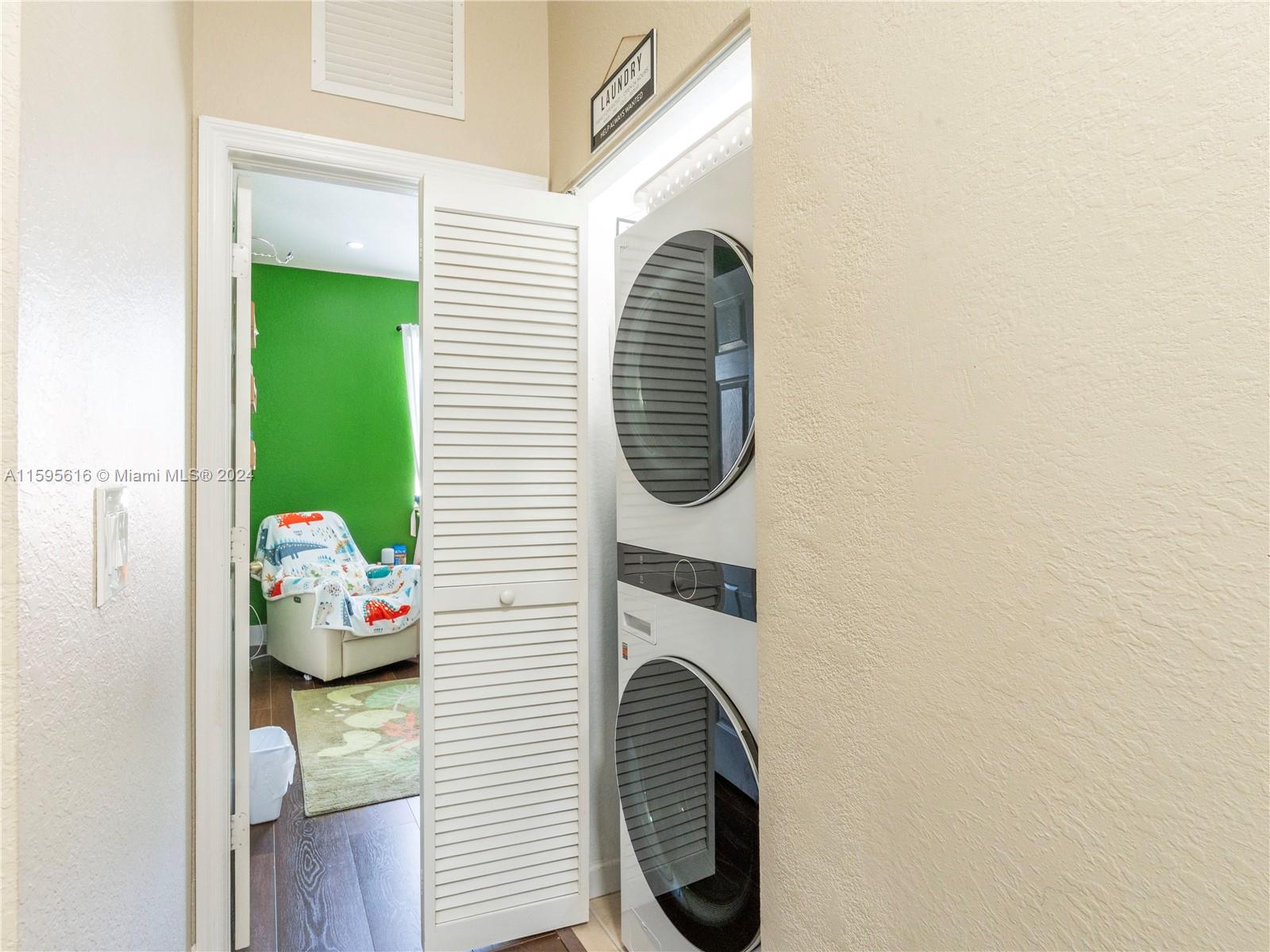 9237 Southwest 227th Street, Unit 6 Cutler Bay, FL 33190 - Photo 22 of 41 a close view of a utility room with dryer and washer