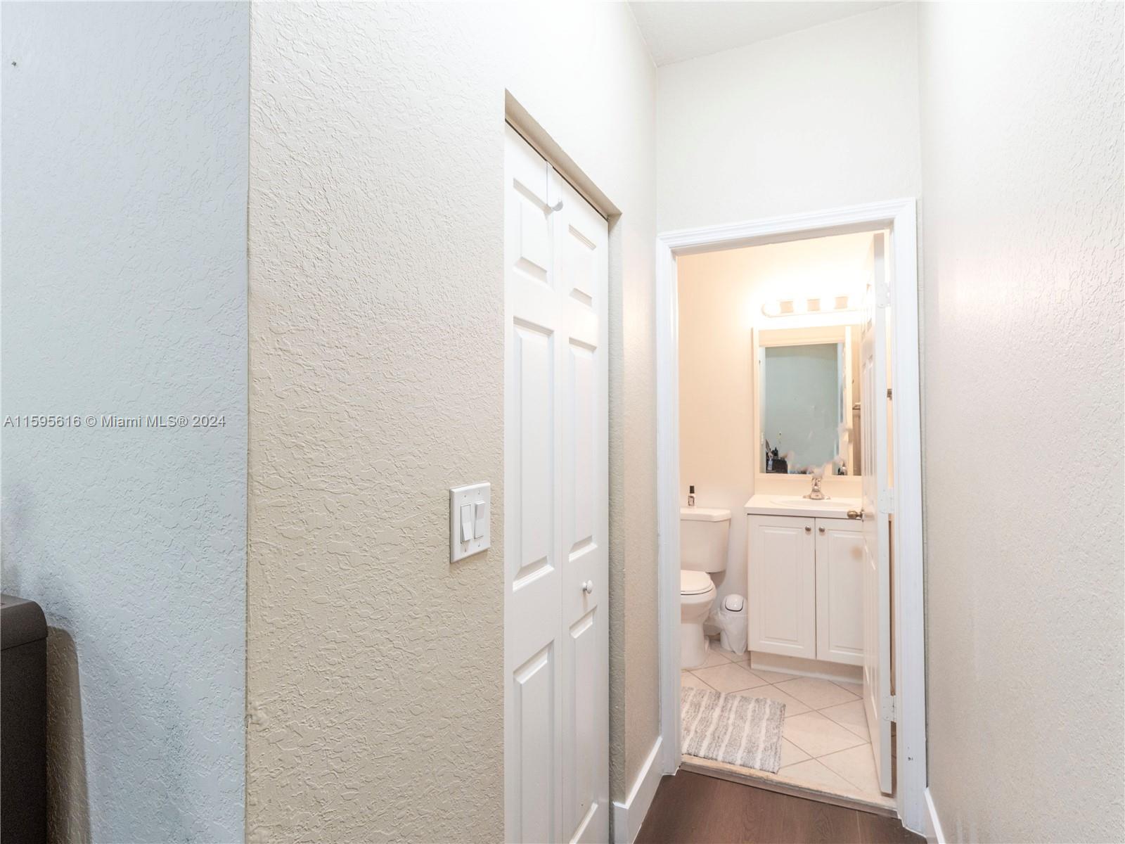 9237 Southwest 227th Street, Unit 6 Cutler Bay, FL 33190 - Photo 30 of 41 a bathroom with a glass door shower