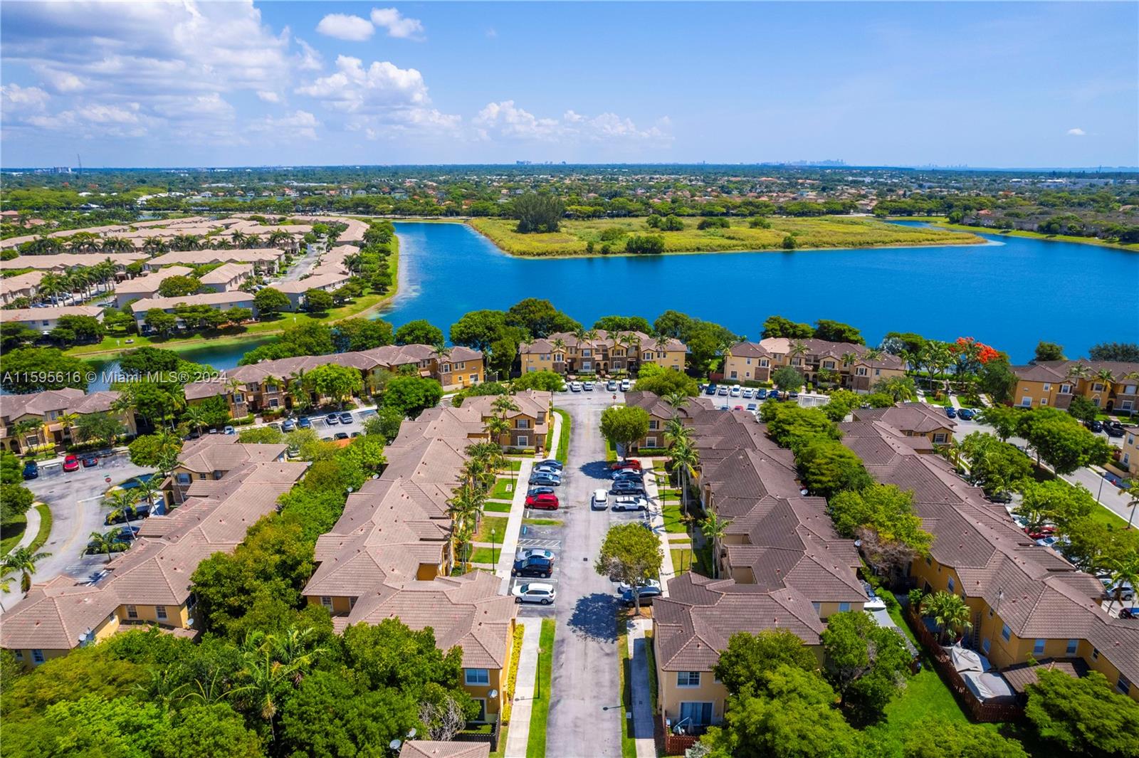 9237 Southwest 227th Street, Unit 6 Cutler Bay, FL 33190 - Photo 35 of 41 an aerial view of residential houses with outdoor space