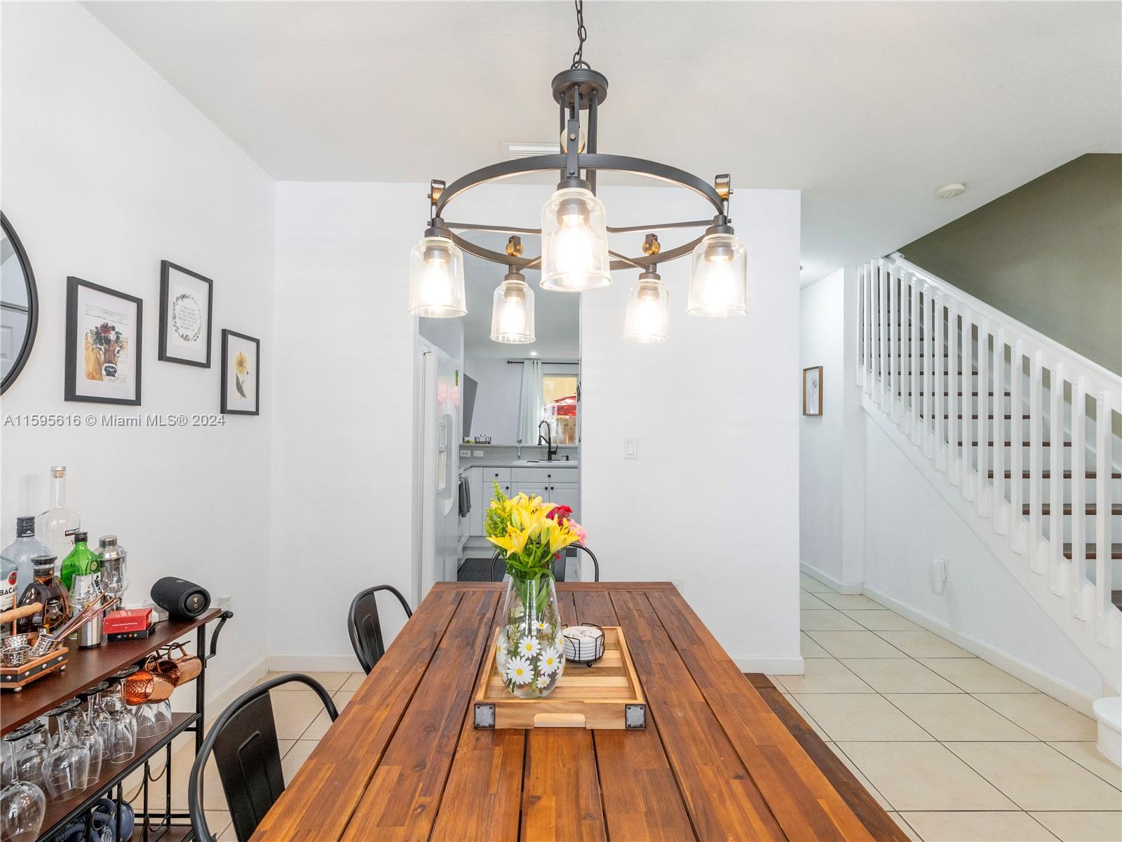 9237 Southwest 227th Street, Unit 6 Cutler Bay, FL 33190 - Photo 6 of 41 a view of a dining room with a table and chairs