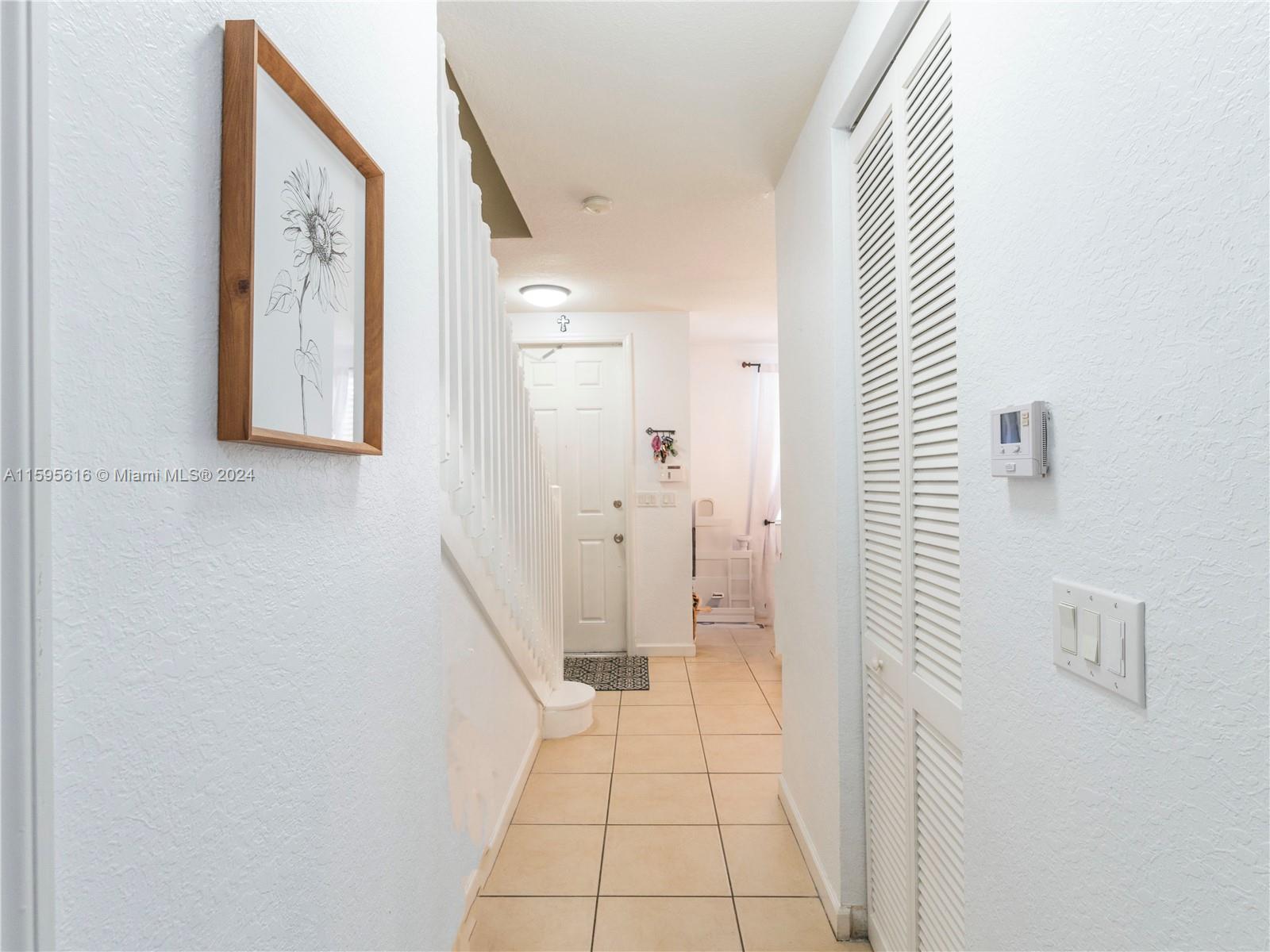 9237 Southwest 227th Street, Unit 6 Cutler Bay, FL 33190 - Photo 10 of 41 a bathroom with a sink and a mirror
