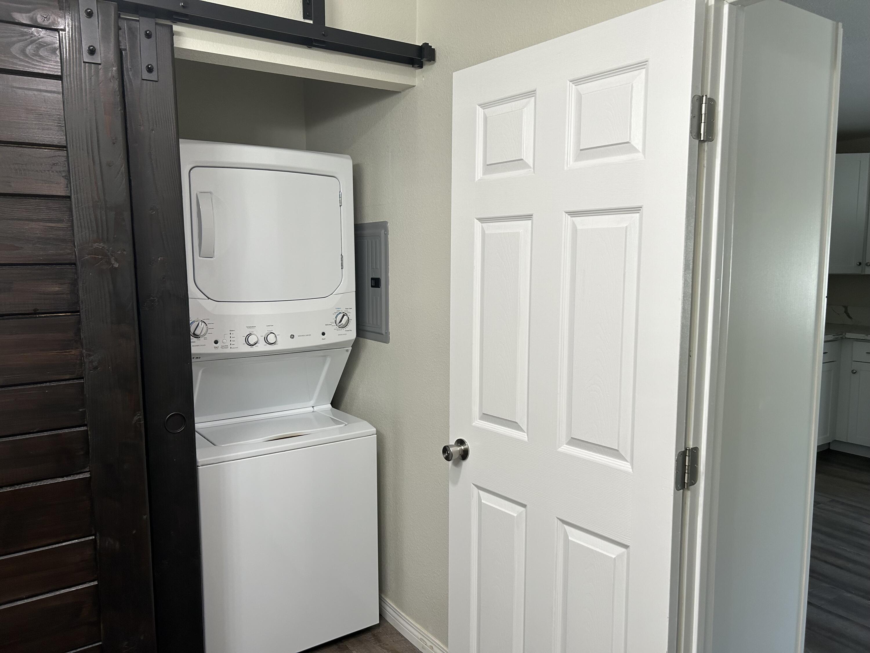 3344 West Ave L Lancaster, CA 93536 - Photo 7 of 9 a utility room with dryer and washer