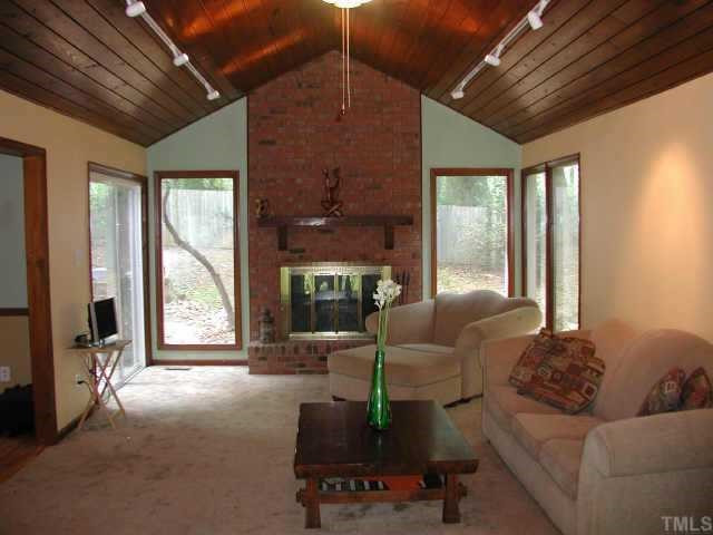1413 Princess Anne Road Raleigh, NC 27607 - Photo 4 of 7 Beautiful vaulted ceilings in family room. Great windows! Wood burning fireplace. Other