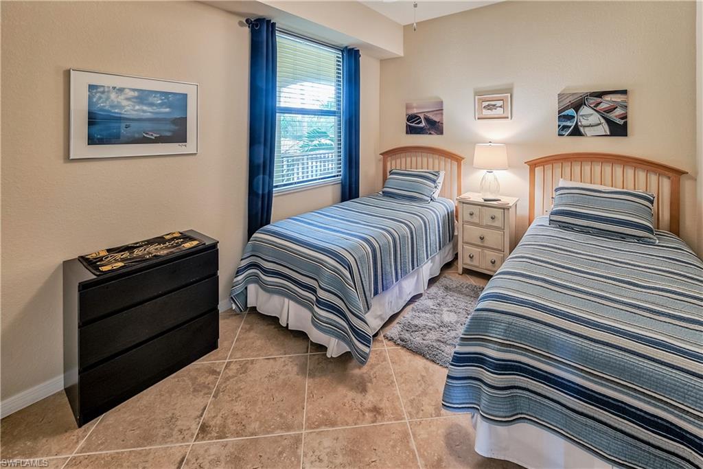 9735 Acqua Court, Unit 622 Naples, FL 34113 - Photo 14 of 34 a bedroom with bed and a window