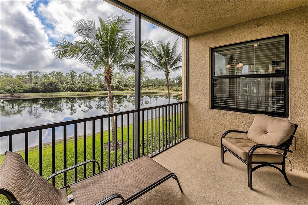 9735 Acqua Court, Unit 622 Naples, FL 34113 - Photo 17 of 34 a balcony with table and chairs
