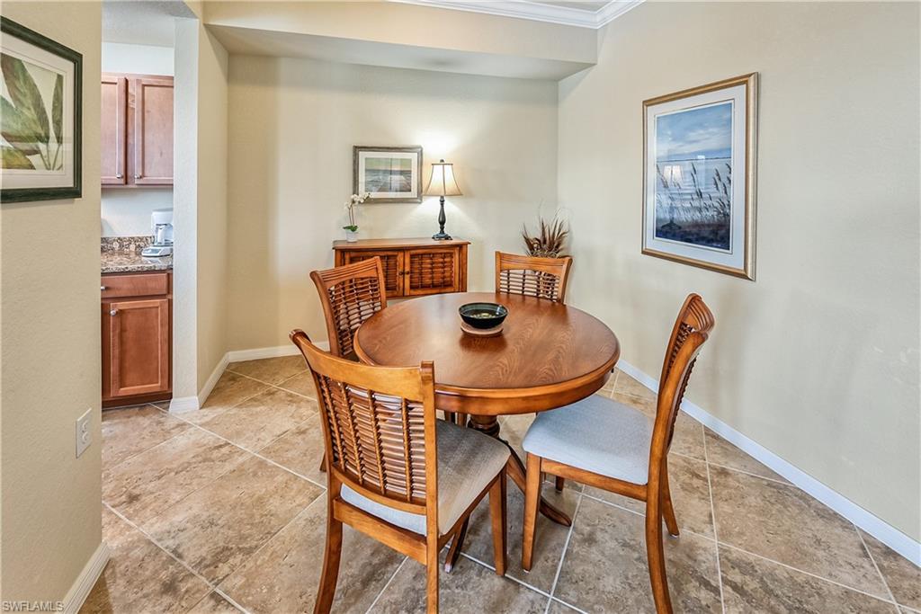 9735 Acqua Court, Unit 622 Naples, FL 34113 - Photo 6 of 34 a view of a dining room with furniture