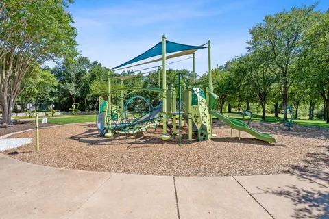 a view of a park with swings
