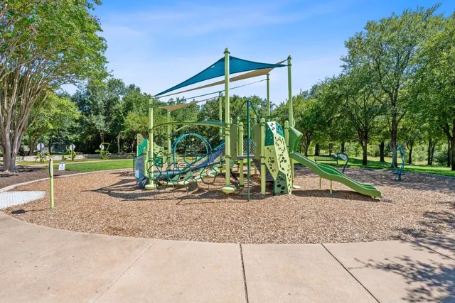 a view of a park with swings