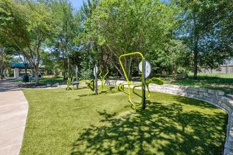 a view of a bench in a backyard