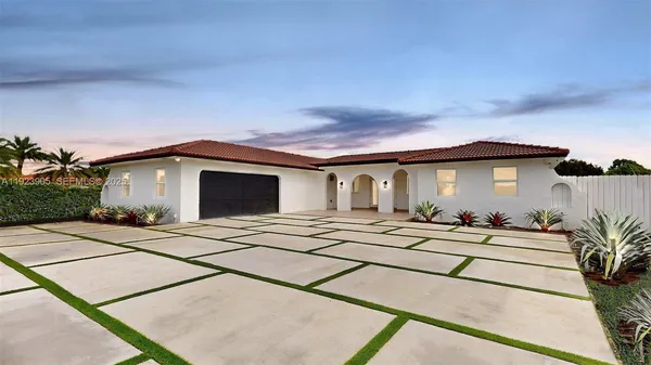 a front view of a house with yard