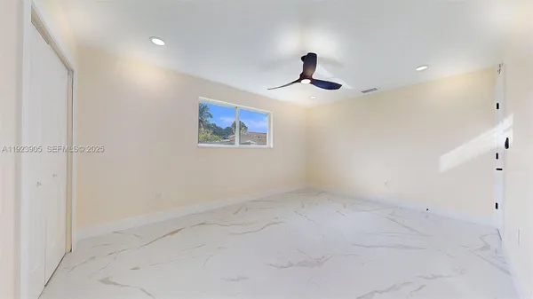 a view of an empty room with a window