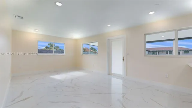 a aerial view of a house with a yard