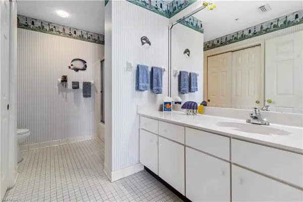 a bathroom with a shower and a toilet