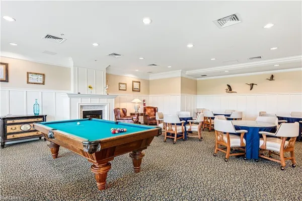 a large room with lots of chairs and chandelier