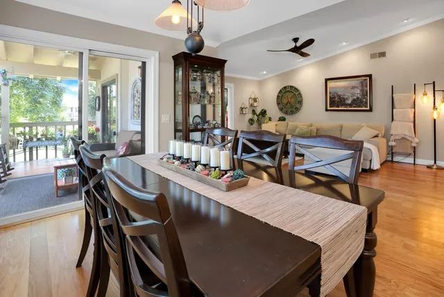 a view of a dining room with furniture window and wooden floor
