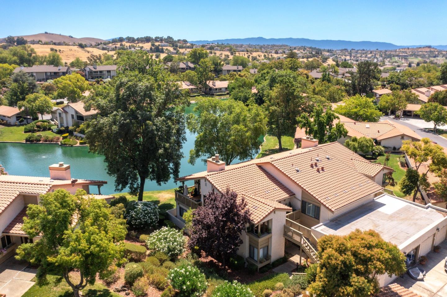8386 Riesling Way San Jose, CA 95135 - Photo 2 of 45 an aerial view of a house with a garden and lake view