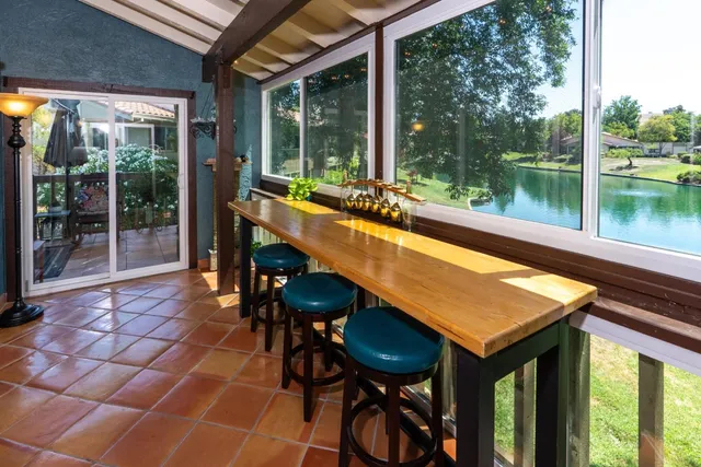 a swimming pool with outdoor seating and yard