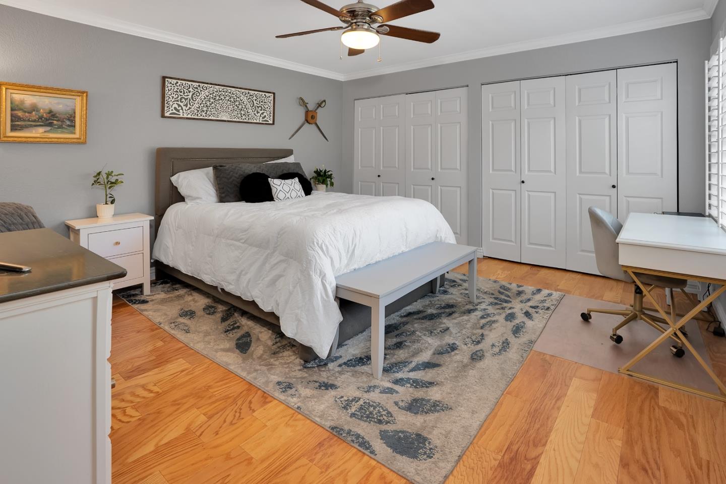 8386 Riesling Way San Jose, CA 95135 - Photo 29 of 45 a bedroom with a bed and a table in it