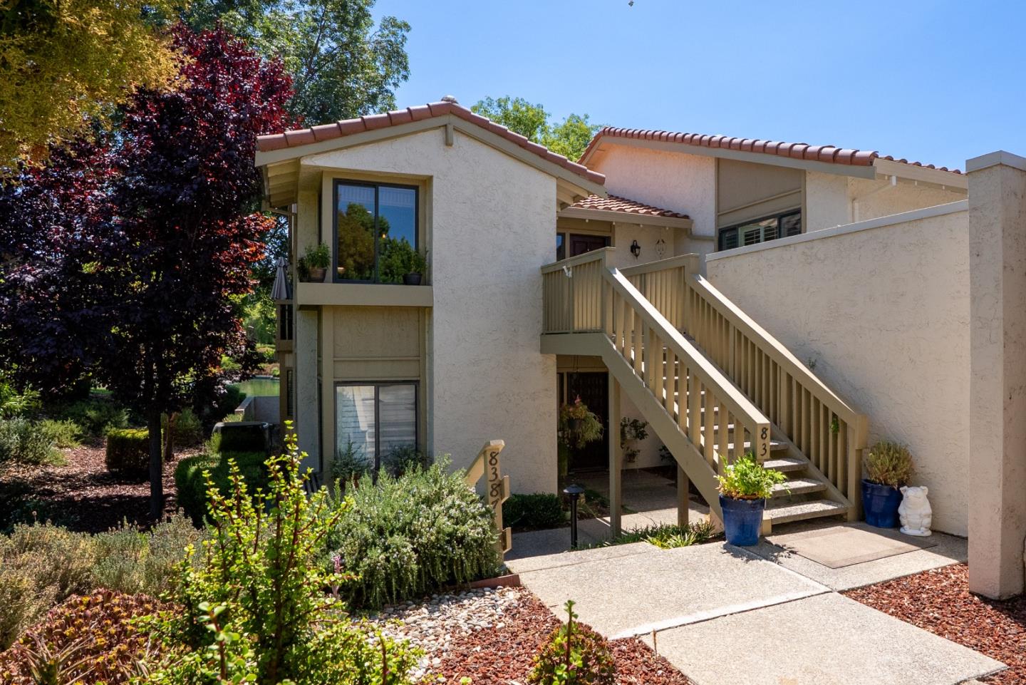 8386 Riesling Way San Jose, CA 95135 - Photo 3 of 45 a view of a house with wooden stairs and potted plants