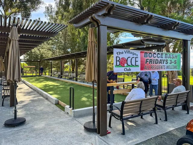 a view of outdoor space with a table and chairs