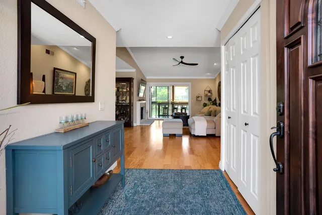 a hallway with living room and furniture