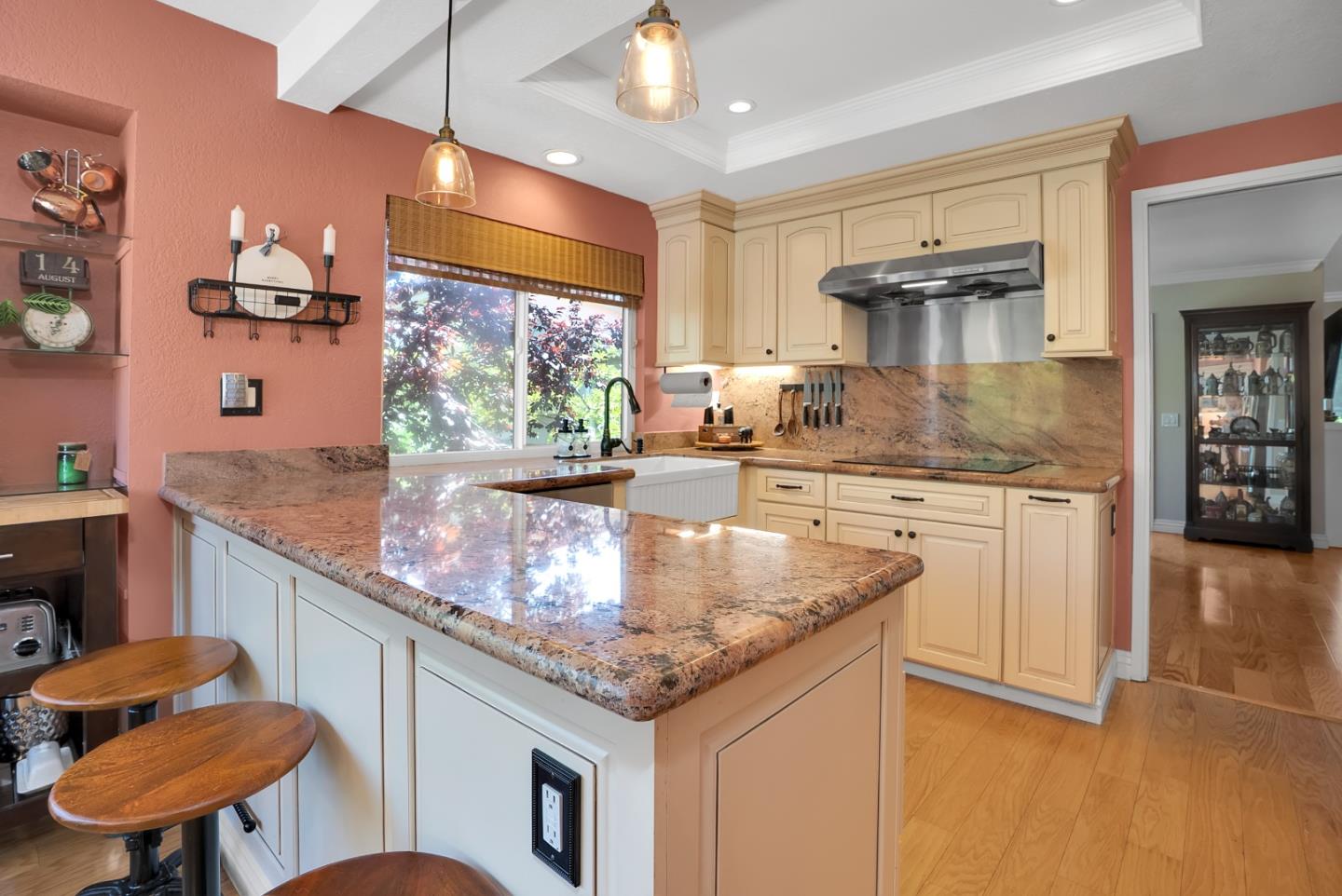 8386 Riesling Way San Jose, CA 95135 - Photo 8 of 45 a kitchen with stainless steel appliances granite countertop a kitchen island a stove and a sink