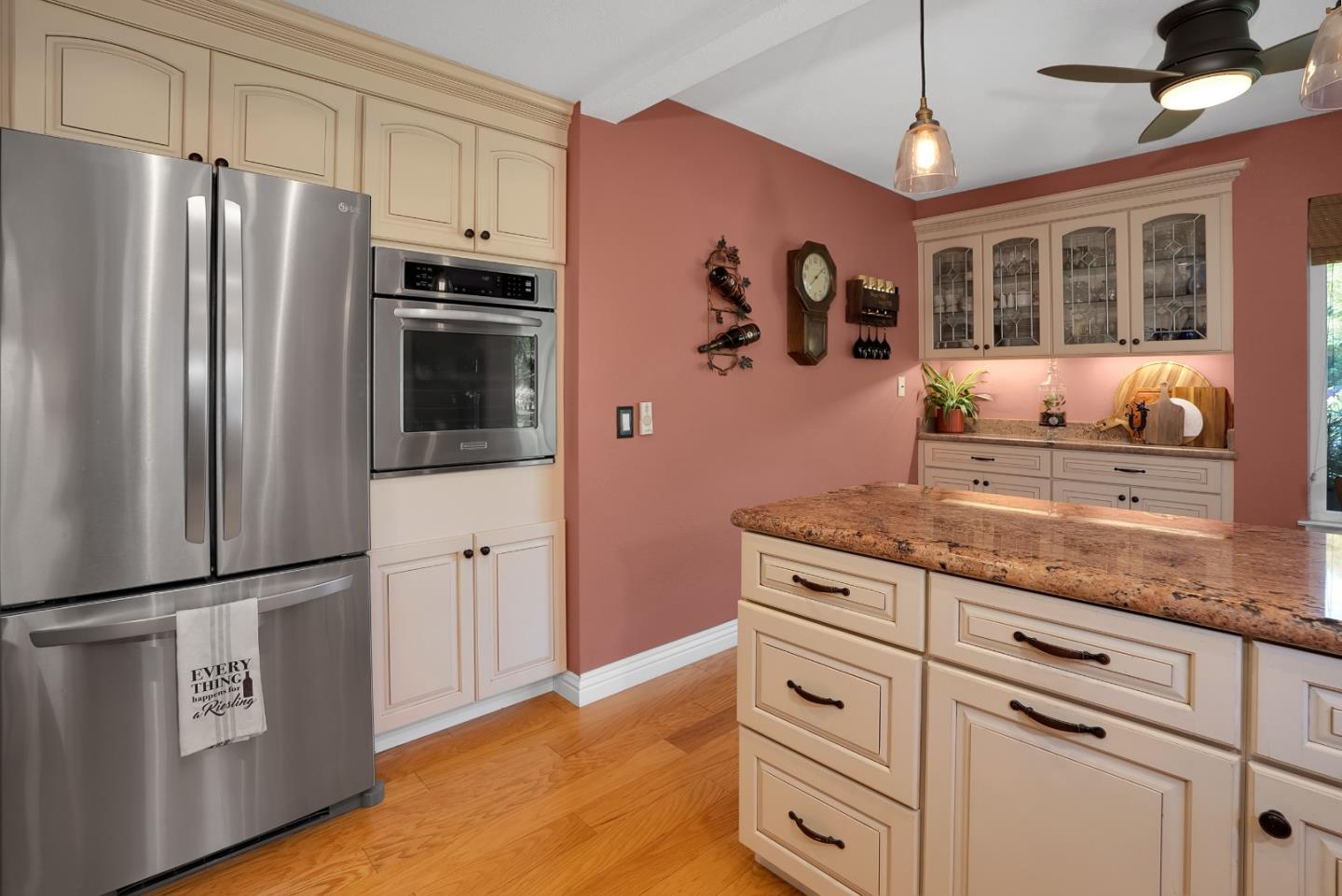 8386 Riesling Way San Jose, CA 95135 - Photo 10 of 45 a kitchen with granite countertop stainless steel appliances a refrigerator stove and microwave