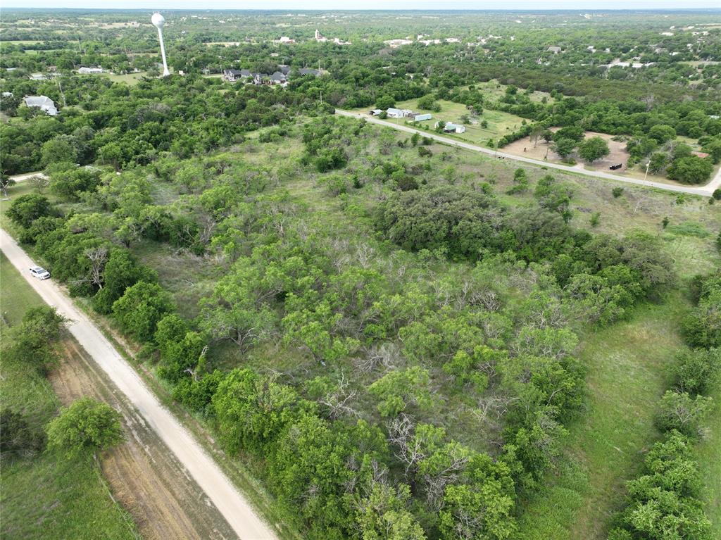 Tbd Tbd Magnolia/ Chestnut Street Hico, TX 76457 - Photo 1 of 11 an aerial view of residential houses with outdoor space and trees