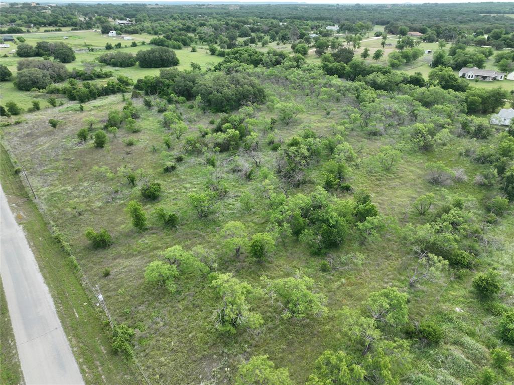 Tbd Tbd Magnolia/ Chestnut Street Hico, TX 76457 - Photo 9 of 11 a view of a green field with lots of trees