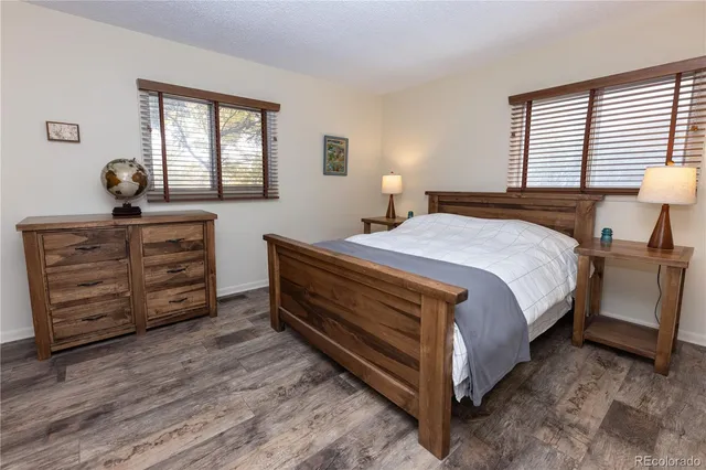 a bed room with a bed and a windows