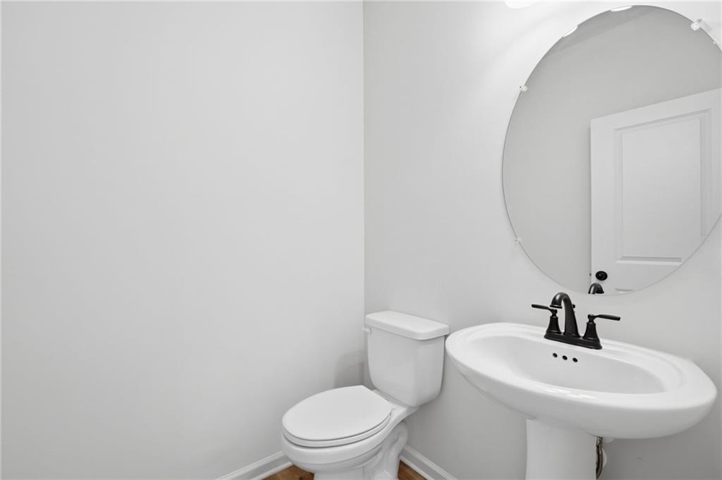 299 Summit View Lane, Unit 5 Jasper, GA 30143 - Photo 11 of 43 a bathroom with a sink a toilet and mirror