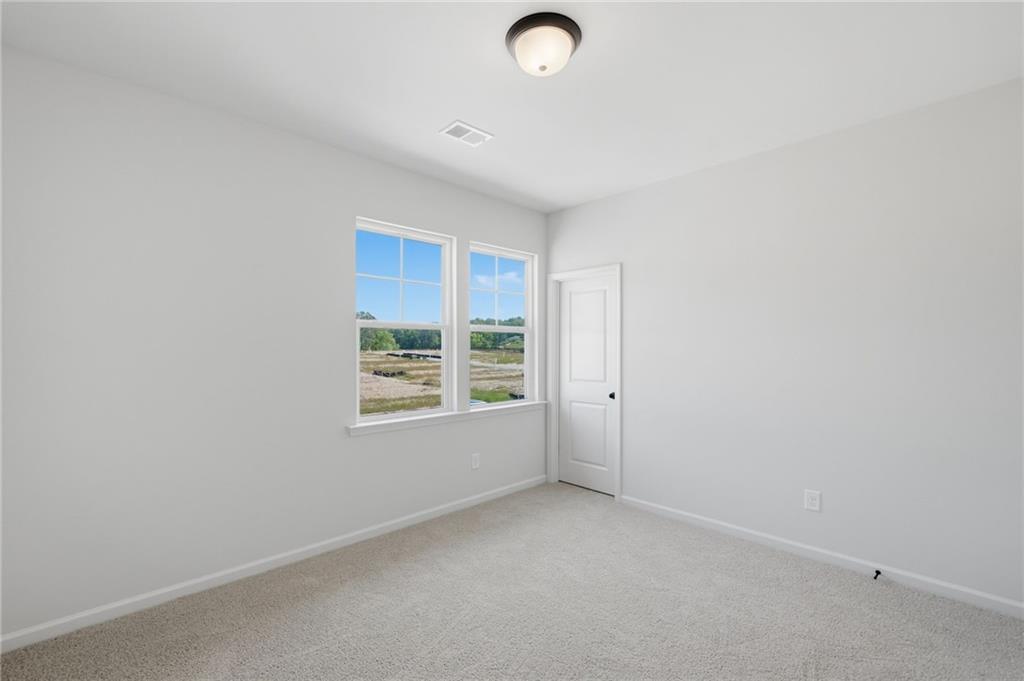 299 Summit View Lane, Unit 5 Jasper, GA 30143 - Photo 17 of 43 an empty room with a window