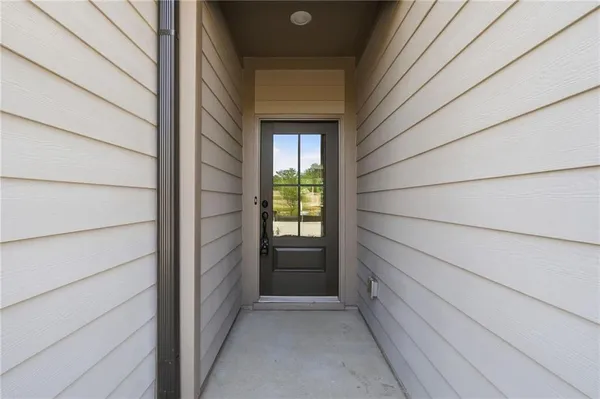 a view of entry way with wooden wall