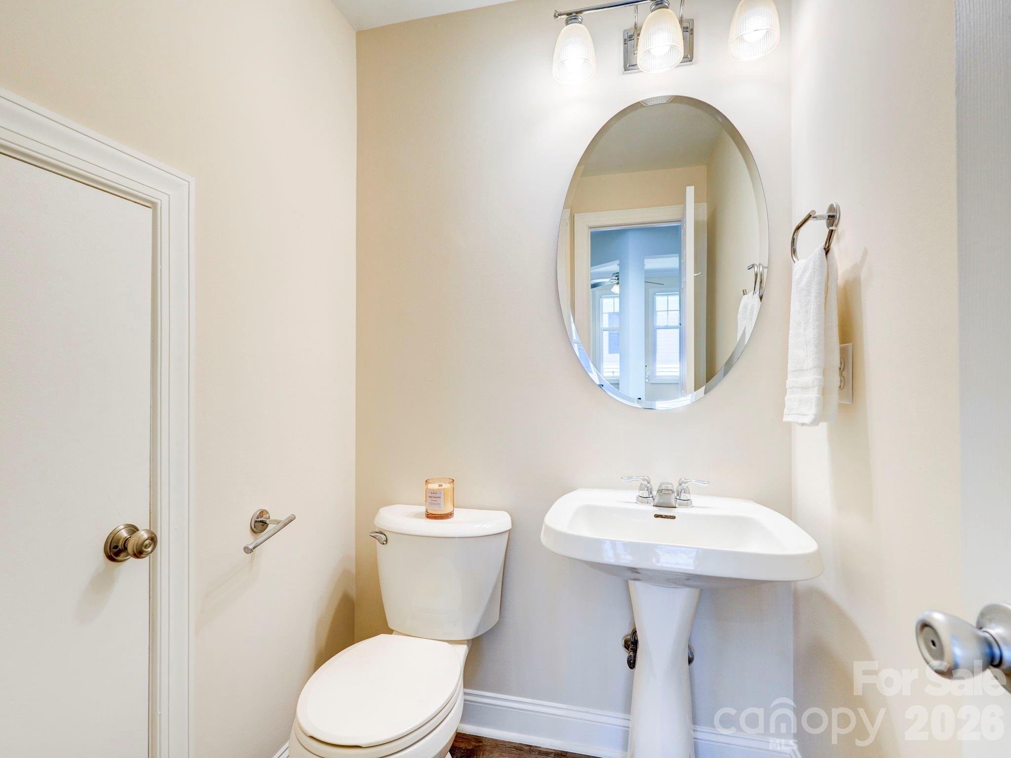 2025 Gable Way Lane Matthews, NC 28104 - Photo 17 of 36 a bathroom with a toilet sink and mirror