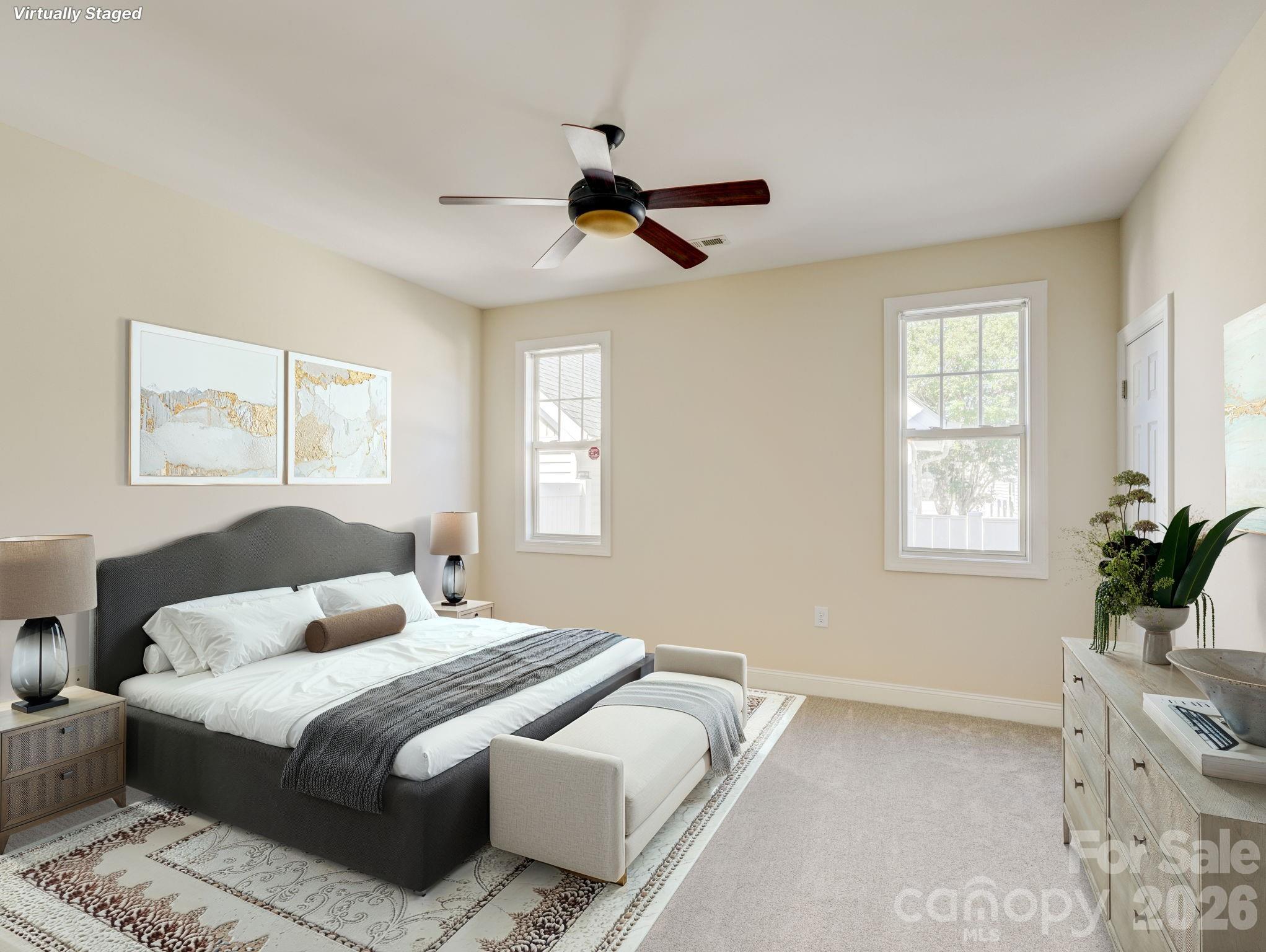 2025 Gable Way Lane Matthews, NC 28104 - Photo 25 of 36 a bedroom with a large bed and wooden floor