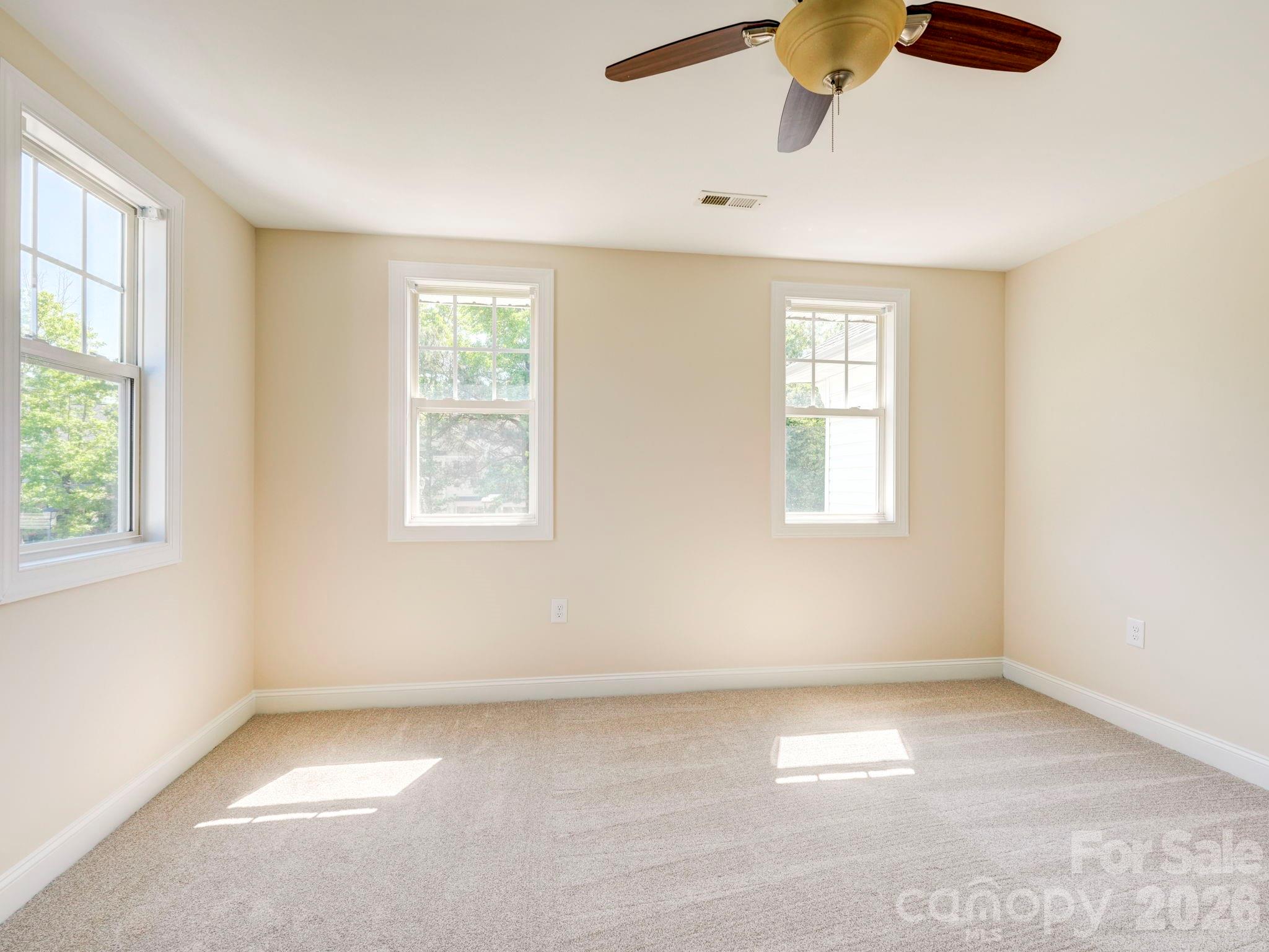 2025 Gable Way Lane Matthews, NC 28104 - Photo 29 of 36 an empty room with windows