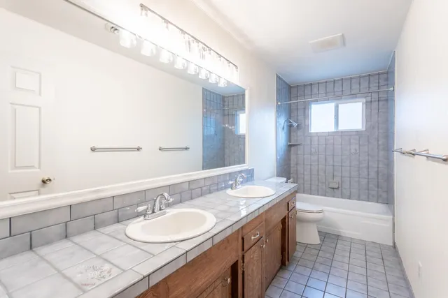 a view of a porch with furniture and wooden fence