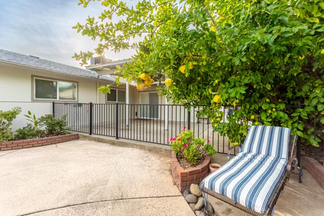 a view of a swimming pool with a patio