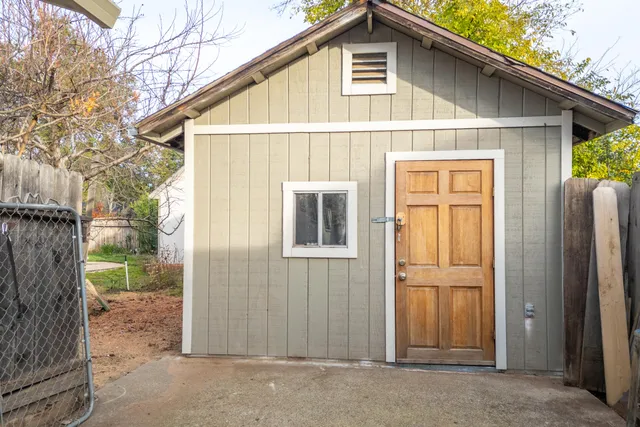 a kitchen with granite countertop stainless steel appliances a stove sink and microwave