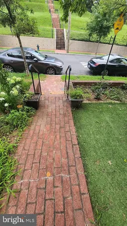 a view of a backyard with sitting area