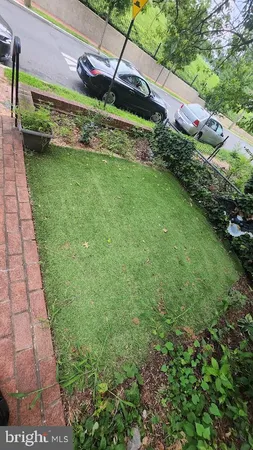 a view of a garden with a building